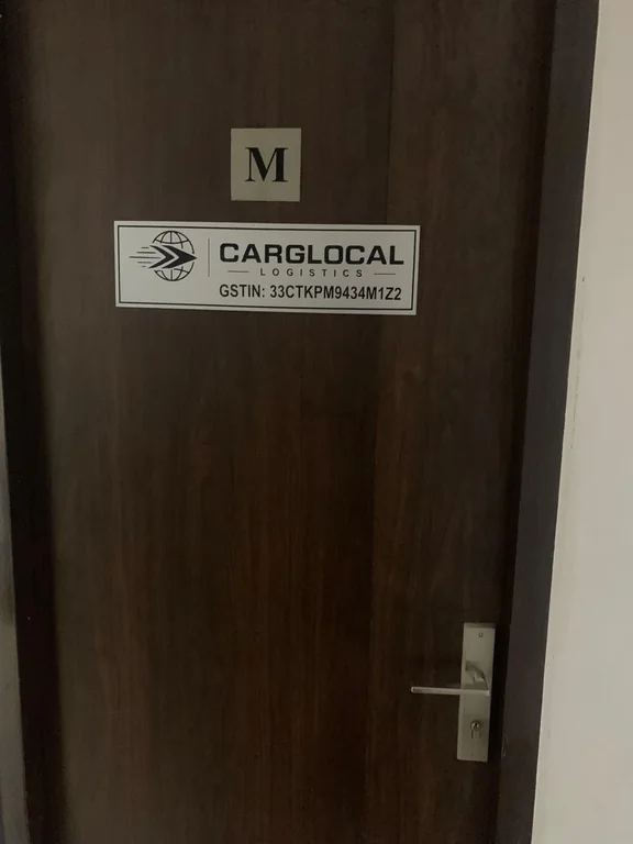 Door bearing the Carglocal Logistics office sign